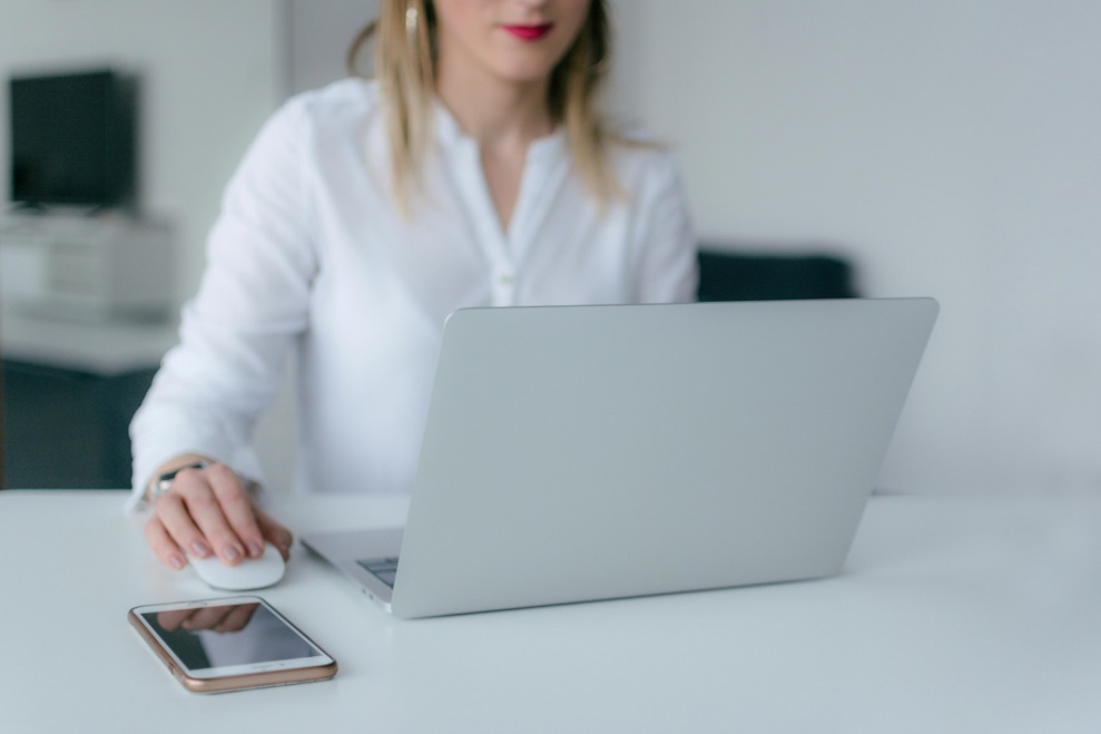 Woman intently working on her laptop